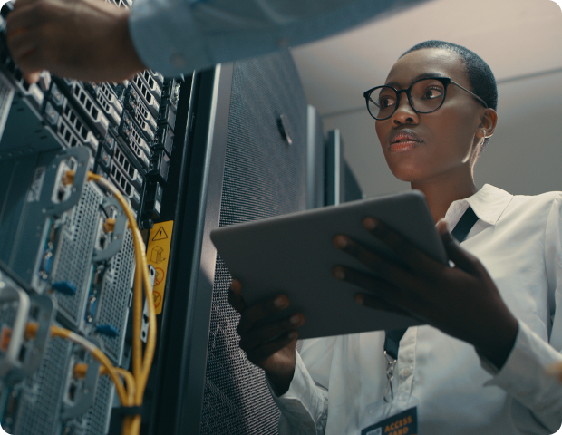 female engineer looking at server rack